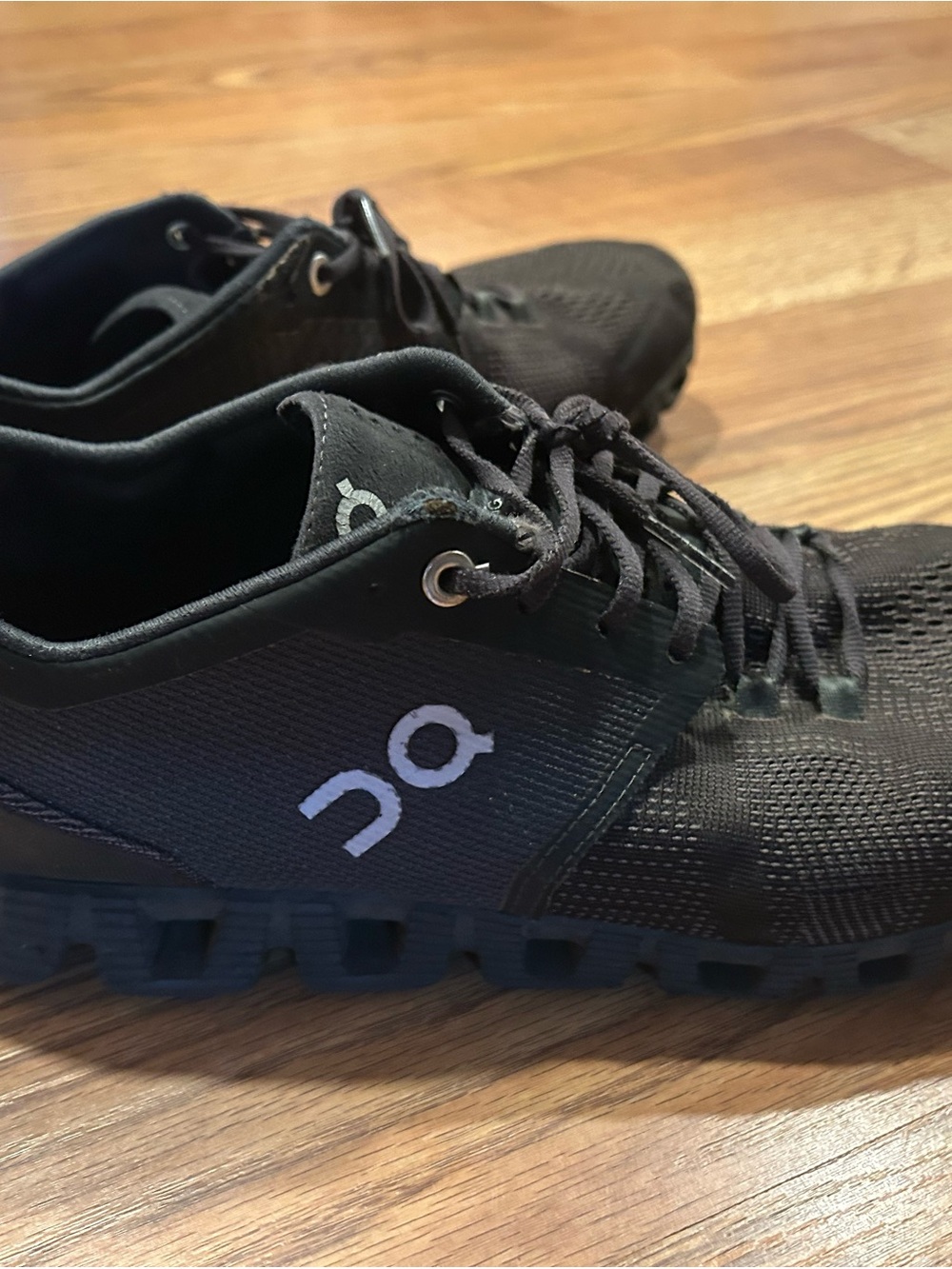 On Running women Cloud Athletic Shoes in Black with White Logo on cloud